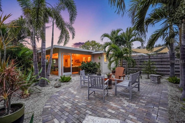 view of patio terrace at dusk