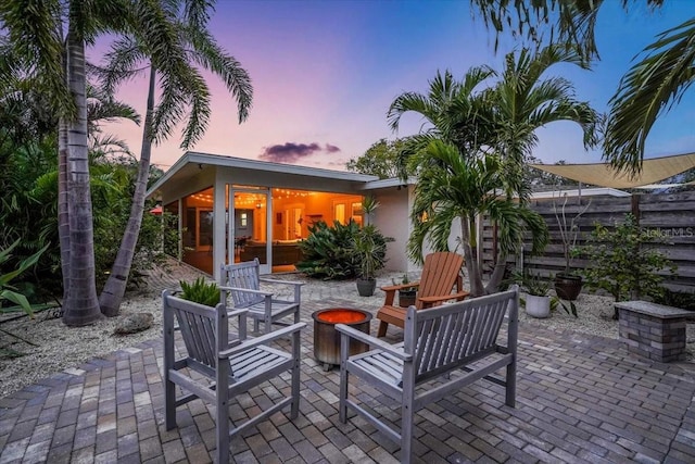 patio terrace at dusk with a fire pit