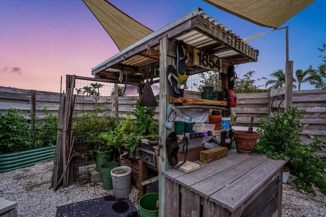 view of patio terrace at dusk