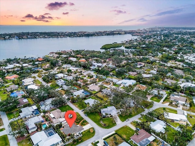 aerial view at dusk with a water view