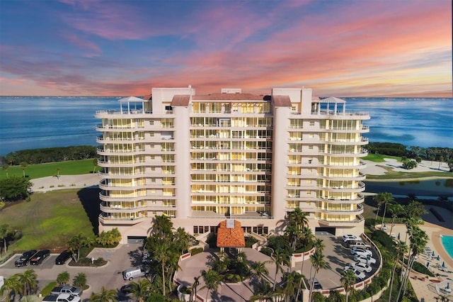 outdoor building at dusk featuring a water view