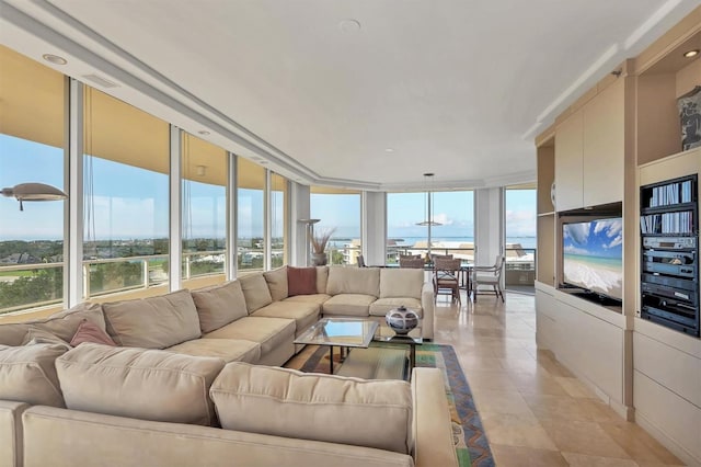 living room featuring expansive windows and light tile patterned floors