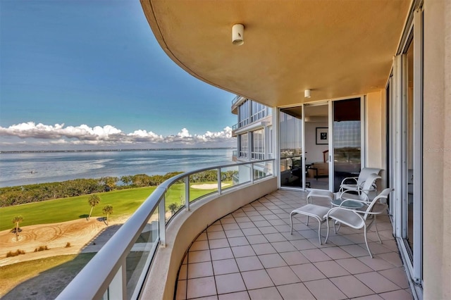 balcony featuring a water view