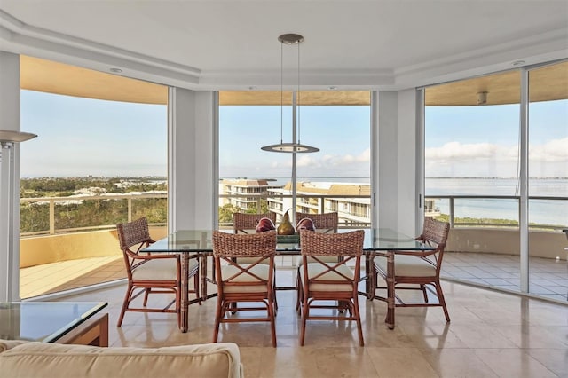 sunroom with a water view