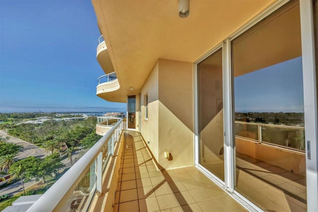 balcony featuring a water view