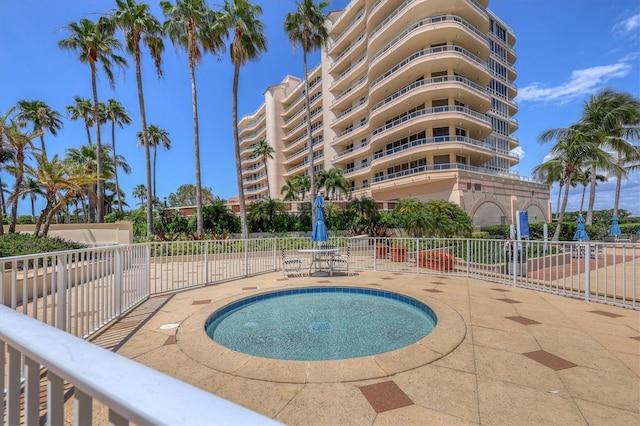 view of swimming pool featuring a patio area