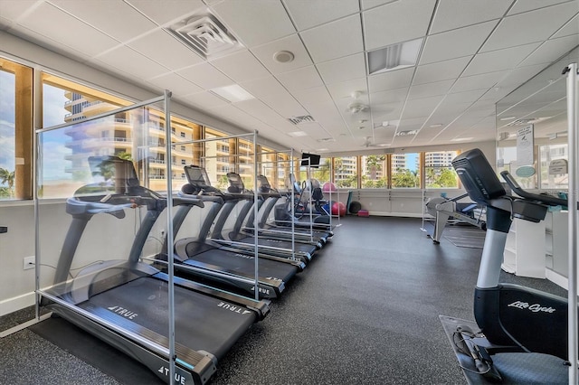 exercise room featuring a drop ceiling