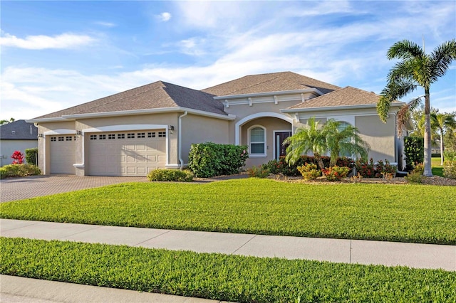 view of front facade with a front lawn and a garage