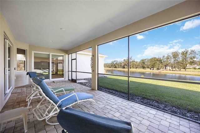 sunroom with a water view