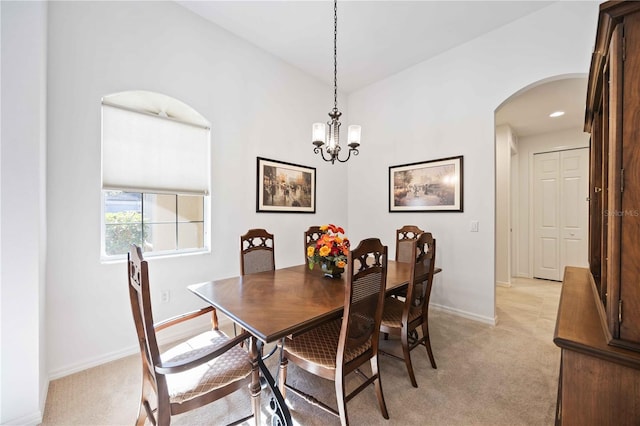 dining space with an inviting chandelier