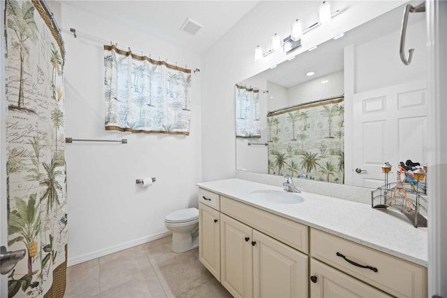 bathroom featuring tile patterned floors, curtained shower, vanity, and toilet