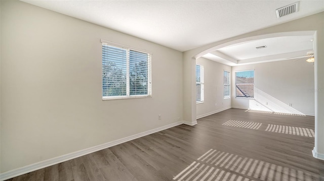 spare room with wood-type flooring and ceiling fan