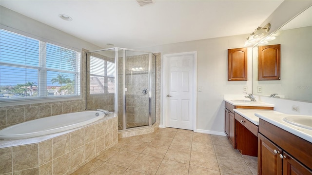 bathroom featuring vanity, tile patterned floors, and separate shower and tub