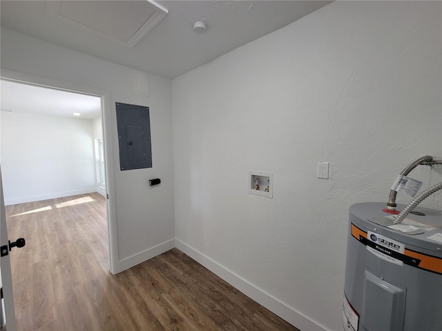 washroom featuring hardwood / wood-style floors, electric water heater, electric panel, and washer hookup