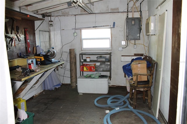 basement featuring a workshop area and electric panel