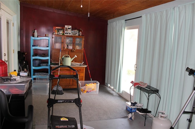 interior space with concrete floors and wooden ceiling