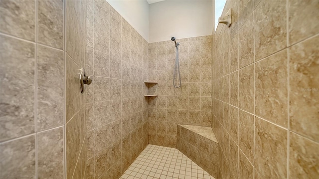 bathroom featuring a tile shower