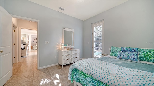 bedroom featuring light tile patterned flooring