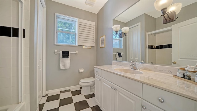 bathroom with toilet, vanity, and walk in shower