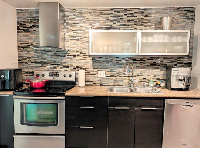 kitchen featuring backsplash, sink, wall chimney exhaust hood, and stainless steel appliances