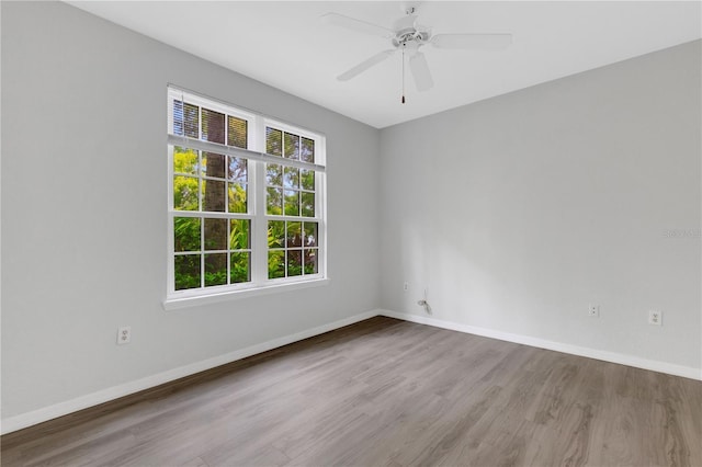 unfurnished room featuring light hardwood / wood-style floors and ceiling fan