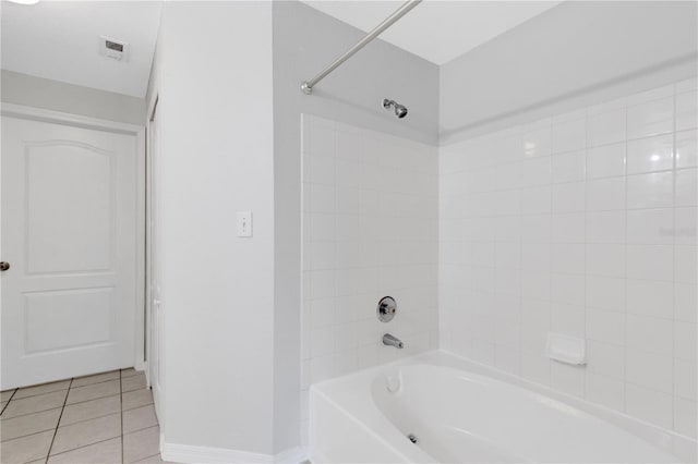 bathroom with tile patterned floors and tiled shower / bath combo