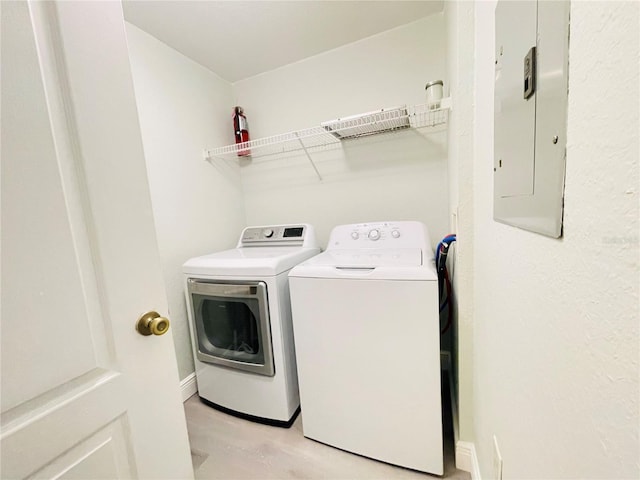 laundry area with washer and dryer and electric panel