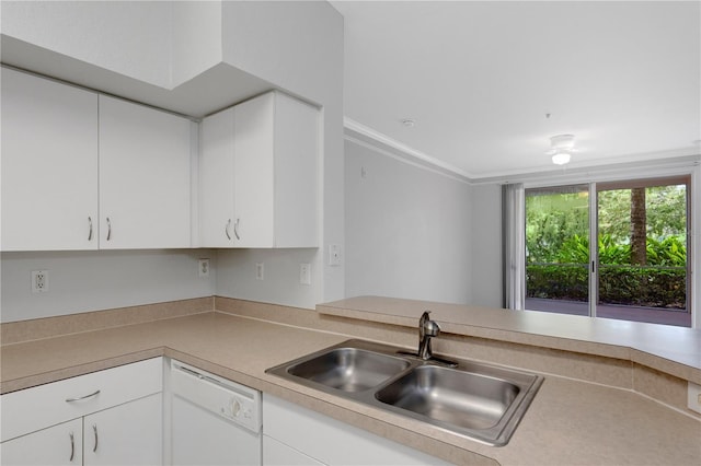 kitchen with crown molding, sink, white cabinets, and white dishwasher