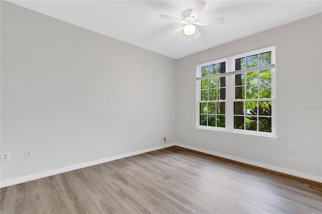 spare room with ceiling fan and light hardwood / wood-style flooring