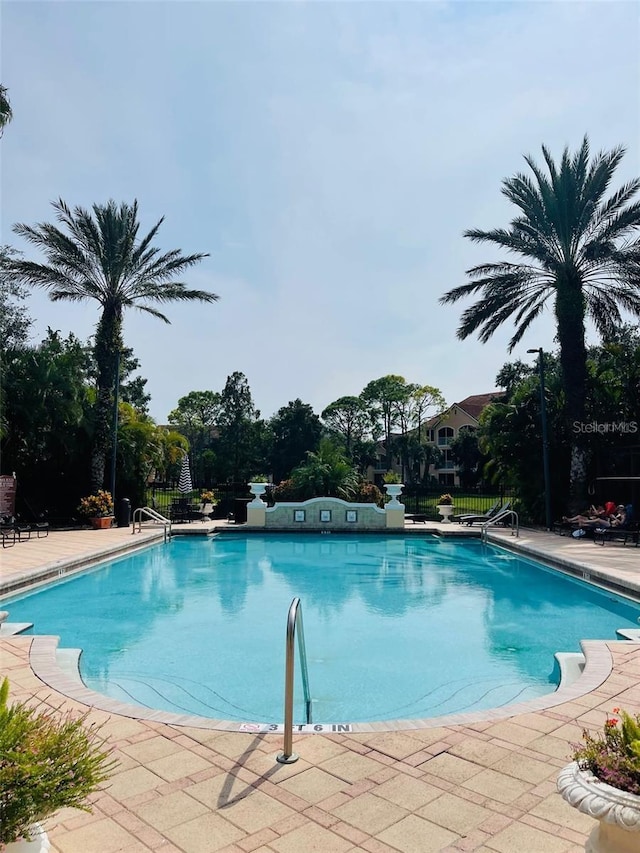 view of swimming pool with a patio