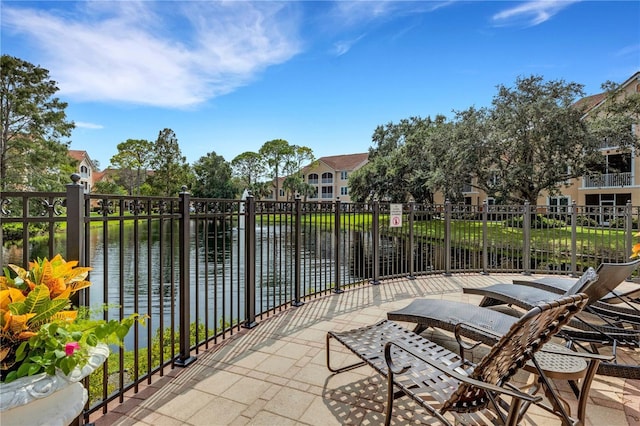 view of patio / terrace with a water view