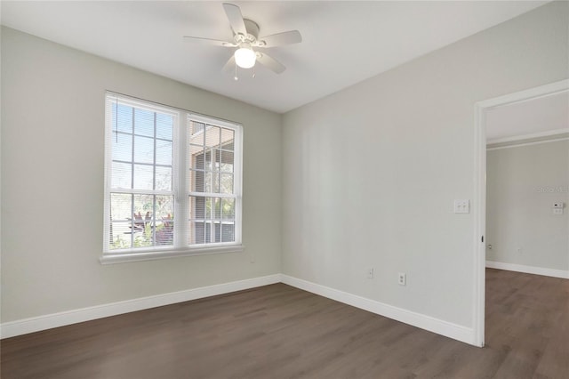 empty room featuring dark hardwood / wood-style floors and ceiling fan