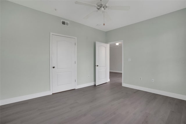 unfurnished bedroom featuring hardwood / wood-style floors and ceiling fan