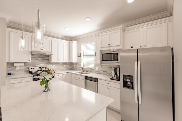 kitchen with light stone counters, stainless steel appliances, sink, white cabinetry, and hanging light fixtures