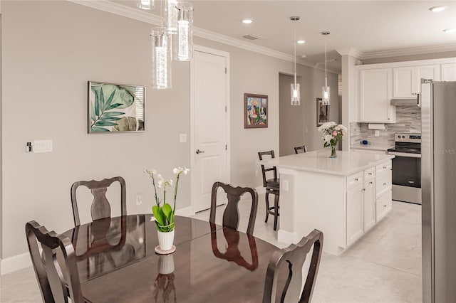 dining space featuring light tile patterned flooring and ornamental molding