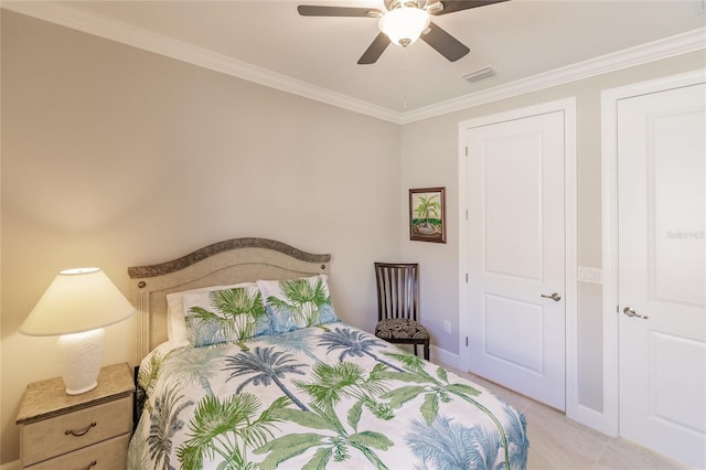 bedroom with ceiling fan and ornamental molding