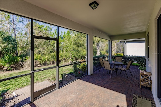 unfurnished sunroom with plenty of natural light