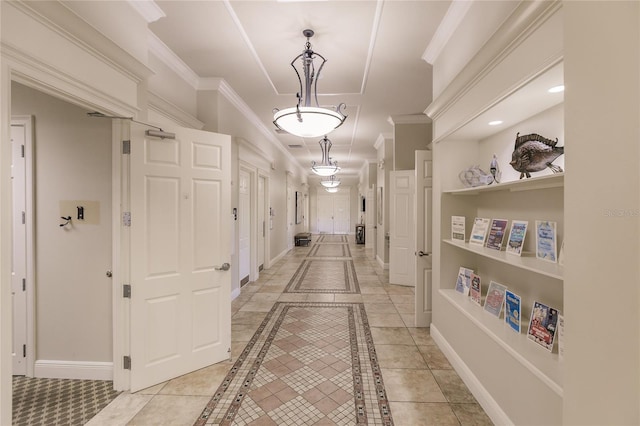 hallway featuring light tile patterned floors and ornamental molding