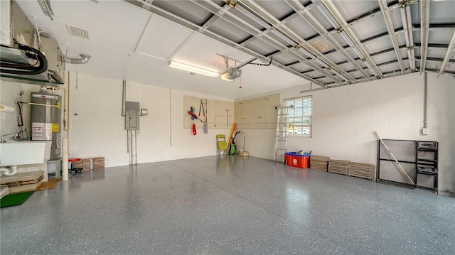 garage with strapped water heater, electric panel, and a garage door opener