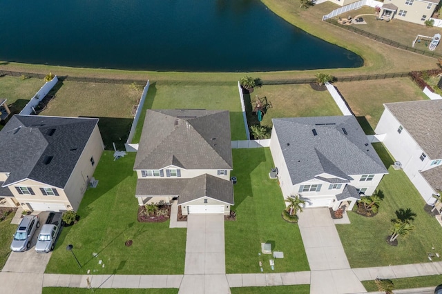 birds eye view of property with a water view