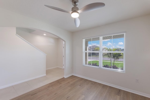 empty room featuring ceiling fan and light wood-type flooring