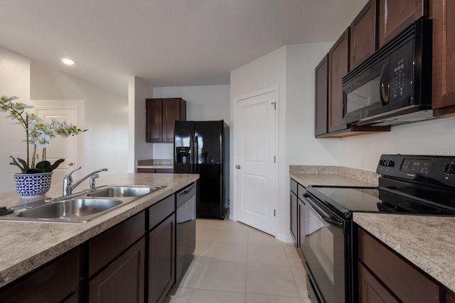 kitchen featuring light tile patterned flooring, dark brown cabinets, sink, and black appliances