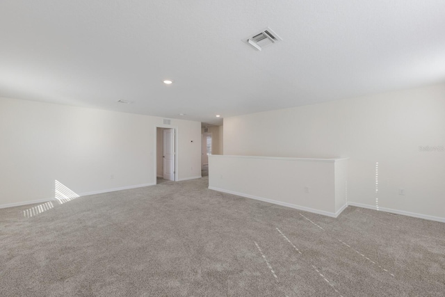 empty room featuring light carpet