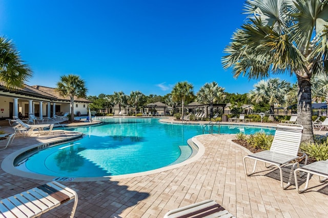 view of pool featuring a patio and a pergola