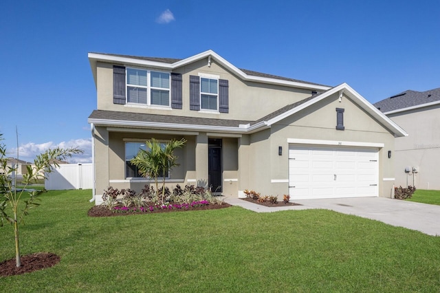 view of front of home featuring a garage and a front yard