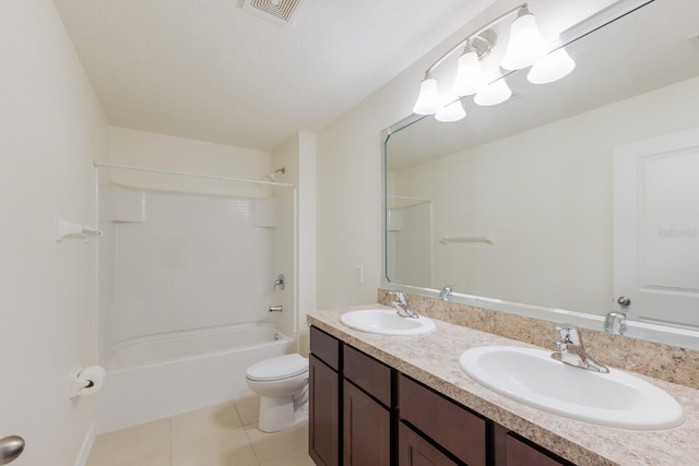 full bathroom featuring tile patterned floors,  shower combination, toilet, and vanity