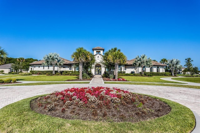 view of property's community with a yard