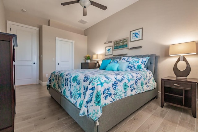 bedroom featuring light hardwood / wood-style floors and ceiling fan