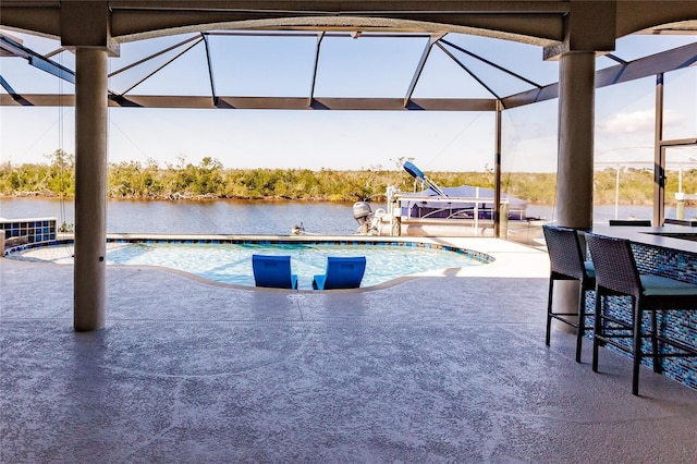 view of pool featuring a water view and a patio area