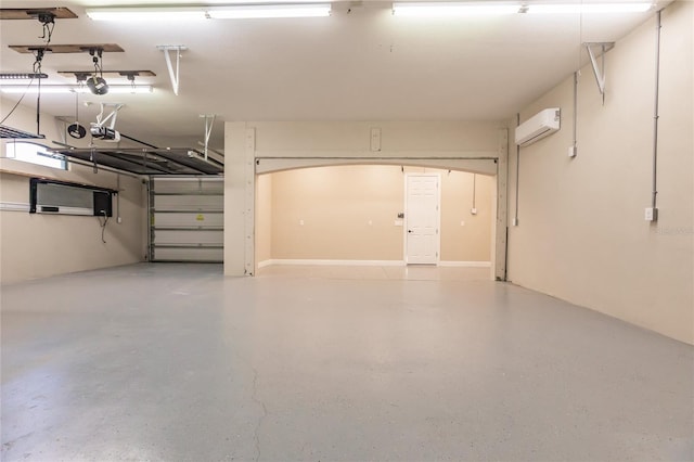 garage with a garage door opener and a wall mounted AC